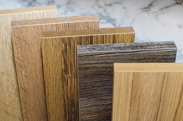 The furniture store presents samples of laminate for the production of furniture.