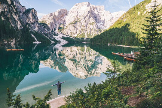 Big World Small People Concept Man Standing On The Beach Of The Mountain Lake