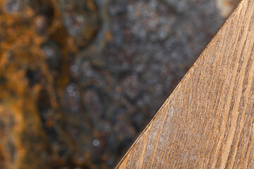 Fototapeta premium Fragment of wood on blurred background, abstract.