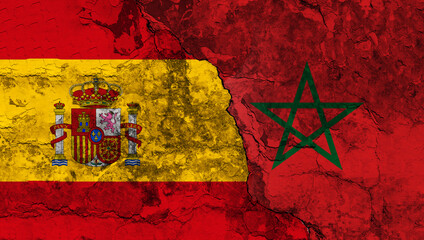 Concept of the Conflict and the Relations between Spain and Morocco with painted flags on a wall...