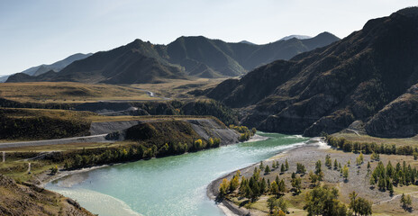 Beautiful panorama of the mountain landscape, road, river and trees