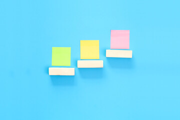 Colored sticky notes on the table. Background for the inscription.