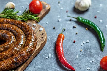 Grilled or Roasted spiral pork sausages with rosemary, salt and peper