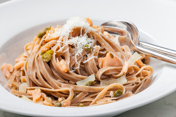 pasta tagliatelle with salmon, capers and parmesan cheese