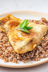 fried carp with bulgur and mint