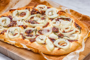 homemade pizza with anchovies and onion