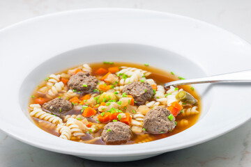 broth with liver dumplings, carrot and pasta