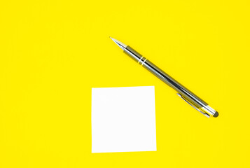 Blank white To Do List Sticker with pen. Searching information on the Internet..Close up of reminder note paper on the yellow background. Copy space. Minimalism, original and creative.