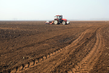 Fototapeta premium Farmers drive planters to grow peas on the farm