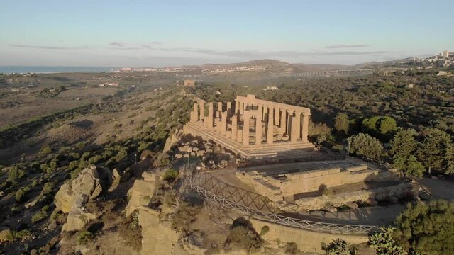 Dawn aerial flyover of Temple of Juno with Concordia Temple beyond