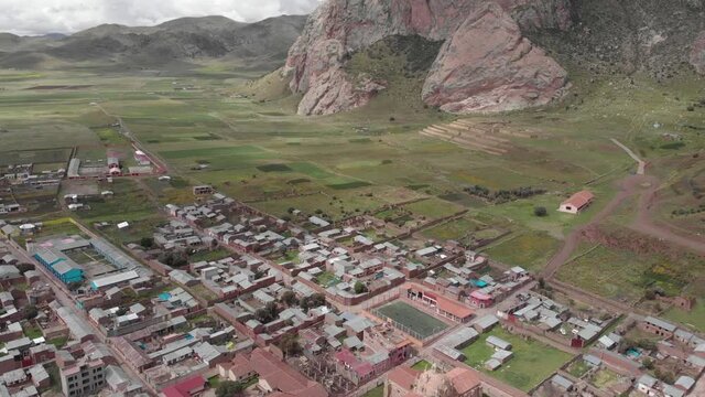 Aerial flyover of St Isabel Church to farms outside Pucara, Peru