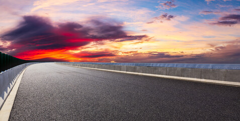 Asphalt highway and beautiful sky cloud scenery at sunset.