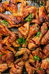 Hot Chicken wings and legs with celery, Food recipe background. Close up. vertical image