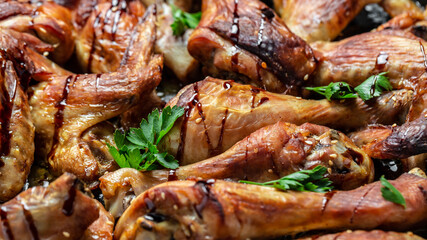Baked chicken wings and legs, banner, menu recipe place for text, top view Food recipe background. Close up