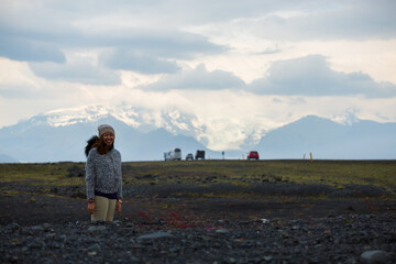 Asian women look at view Fjallsjokull glacier, Iceland