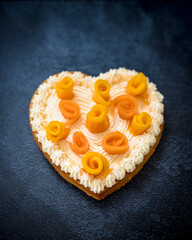 heart shaped cake with mango and melon