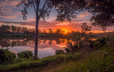 Beautiful Panoramic Riverside Sunset with Cloud Reflections