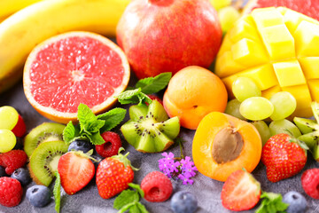 Fototapeta na wymiar assorted of healthy fruits and berries background