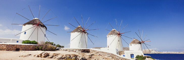 Windmills in the famous Mykonos town, Cyclades, Mykonos island, Greece. Panoramic view