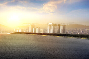 Naklejka premium Asphalt road with modern building and skyscrapers