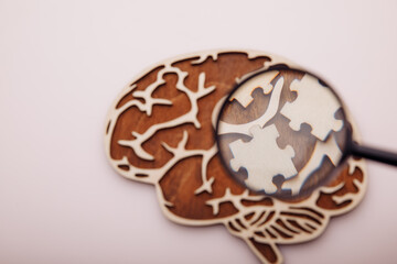Brain with wooden puzzles. Mental Health and problems with memory concept