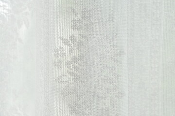 Close up of white lace curtain