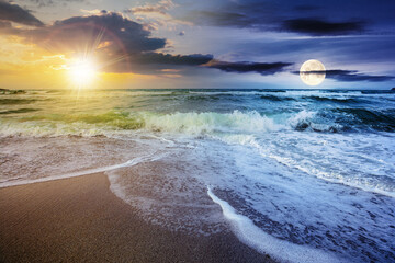 day and night time change concept above sea tide on a cloudy twilight. green waves crashing golden sandy beach with sun and moon above the horizon. storm weather approaching. summer holiday concept - Powered by Adobe