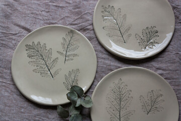 Ceramic plate with close-up impressions of herbs
