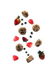 Healthy eating concept - cruchy and berries pouring against white background