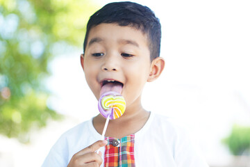 Cute Asian child little Thai boy 2 year old smile make a happy face concept. 