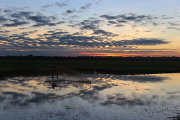 Cambodia. West Lake. Sunrise. The lake was dug in the 10th century to supply water in the dry season to the temples of Angkor. Siem Reap province.