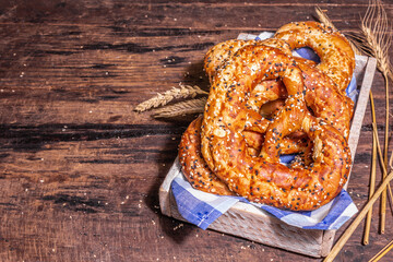 Oktoberfest concept - pretzels on a traditional napkin in a wooden crate
