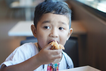 Cute Asian child little Thai boy 2 year old smile make a happy face concept. 