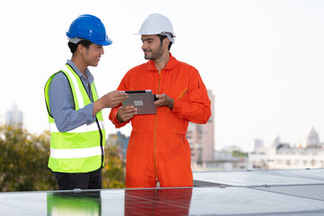 engineers or technicians holding tablet, talking about project with solar panels