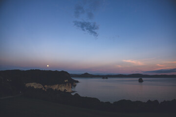 moonset & daybreak in Cathedral Cove, Hahei, Coromandel Peninsula,  New Zealand