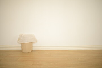 cute brown small bin on white room with floor muji minimal style room white and warm mood background