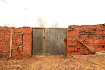 The broken farmhouse gate, North China