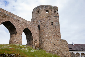 Gothic medieval castle Velhartice in sunny day, tower and stone arch bridge, fortress masonry wall, old stronghold, Velhartice, National Park Sumava, South Bohemia, Czech Republic