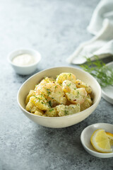 Traditional homemade potato salad with herbs