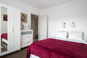 Fototapeta na wymiar cozy bright bedroom in hotel