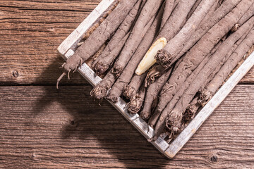 Raw Scorzonera or Spanish salsify, trendy hard light, dark shadow