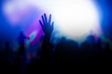 Hand raise up to praise God in a concert.  - obrazy, fototapety, plakaty