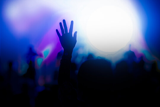 Hand raise up to praise God in a concert. 