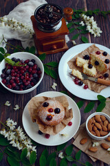 vertical composition. Appetizing muffins with currants on a dark wooden background. Closeup