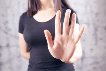 young woman showing stop gesture