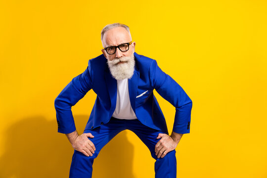 Photo of strict grey beard aged man look you wear spectacles blue jacket isolated on vivid yellow color background