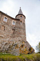 Obraz premium Gothic medieval castle Velhartice in sunny day, tower at the hill near forest, fortress masonry wall, old stronghold, Velhartice, National Park Sumava, South Bohemia, Czech Republic
