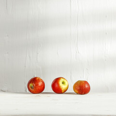 Desk of free space and fresh red apples 