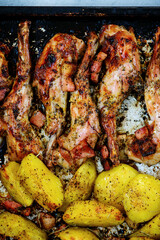 Roast rabbit with potato.top view ..style vintage