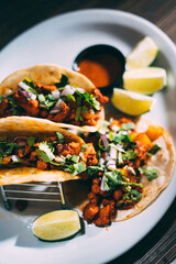 A plate of tacos and tortilla
